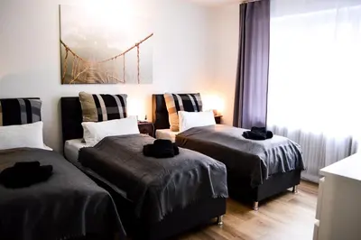 Ein Bett oder Betten in einem Zimmer der Unterkunft Centerapartments Marienstrasse