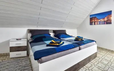 Ein Bett oder Betten in einem Zimmer der Unterkunft Ferienwohnung Belfi