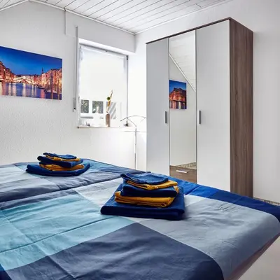 Ein Bett oder Betten in einem Zimmer der Unterkunft Ferienwohnung Belfi