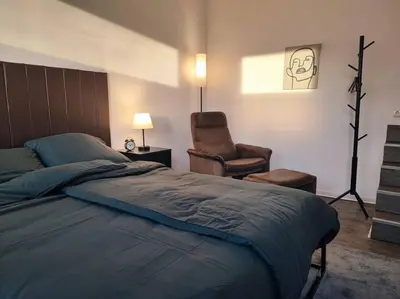 Ein Bett oder Betten in einem Zimmer der Unterkunft Elegantes 3-Schlafzimmer-Nest