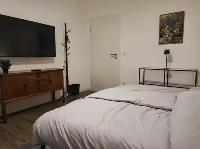 Ein Bett oder Betten in einem Zimmer der Unterkunft Elegantes 3-Schlafzimmer-Nest