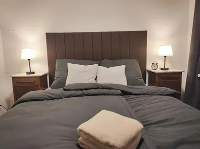 Ein Bett oder Betten in einem Zimmer der Unterkunft Elegantes 3-Schlafzimmer-Nest
