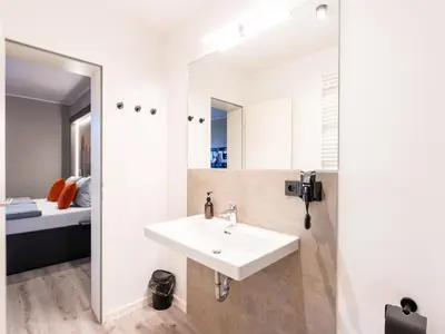 Ein Bett oder Betten in einem Zimmer der Unterkunft JustStay Essen Hotel & Apartments