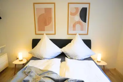 Ein Bett oder Betten in einem Zimmer der Unterkunft Besinnliches Bijou, Klein, aber oho mit Wohlfühlfaktor
