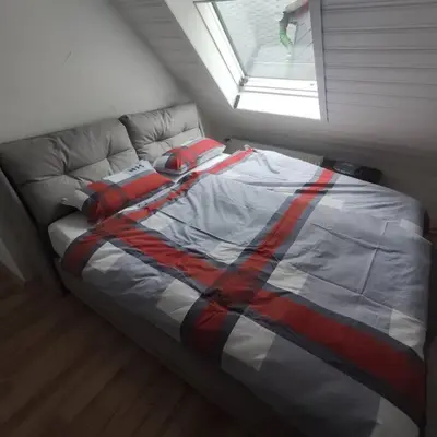 Ein Bett oder Betten in einem Zimmer der Unterkunft Aussicht auf die Altstadt Lennep