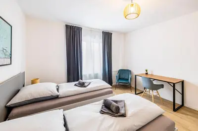 Ein Bett oder Betten in einem Zimmer der Unterkunft Glück Auf Appartements Herkulesstrasse Essen