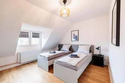 Ein Bett oder Betten in einem Zimmer der Unterkunft Glück Auf Appartements Herkulesstrasse Essen