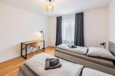 Ein Bett oder Betten in einem Zimmer der Unterkunft Glück Auf Appartements Herkulesstrasse Essen