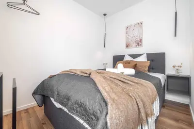 Ein Bett oder Betten in einem Zimmer der Unterkunft MODERN & MINIMAL - Design-Apartment in Stadtmitte