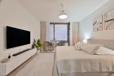 Ein Bett oder Betten in einem Zimmer der Unterkunft Goodliving Apartments Studio mit Balkon & Netflix