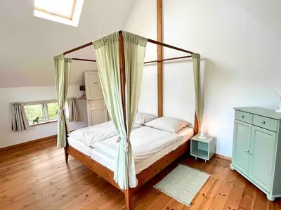 Ein Bett oder Betten in einem Zimmer der Unterkunft Fachwerkhaus am Waldesrand