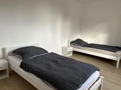 Ein Bett oder Betten in einem Zimmer der Unterkunft Monteur-Domizil, Apartment AVD 6