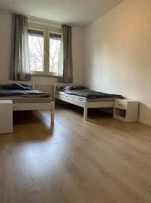 Ein Bett oder Betten in einem Zimmer der Unterkunft Monteur-Domizil, Apartment AVD 6