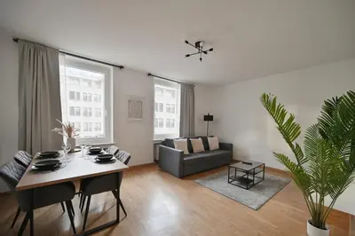 Ein Sitzbereich in der Unterkunft Goodliving Apartments mit Netflix Büro und Parkplatz
