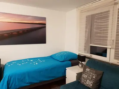 Ein Bett oder Betten in einem Zimmer der Unterkunft FEWO Solingen Abendstrasse