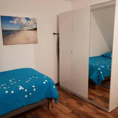 Ein Bett oder Betten in einem Zimmer der Unterkunft FEWO Solingen Abendstrasse
