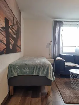 Ein Bett oder Betten in einem Zimmer der Unterkunft FEWO Solingen Abendstrasse