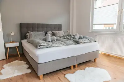 Ein Bett oder Betten in einem Zimmer der Unterkunft bright & grey - Netflix - City - Wifi - 4 Person