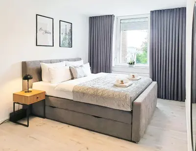 Ein Bett oder Betten in einem Zimmer der Unterkunft LIVATION - Apartments Hamm-Mitte - 2 Zi - Nespresso - SmartTV - freeWiFi - ausgestattete Küche - 24h Check-In - bis 4 Pers pro Apartment