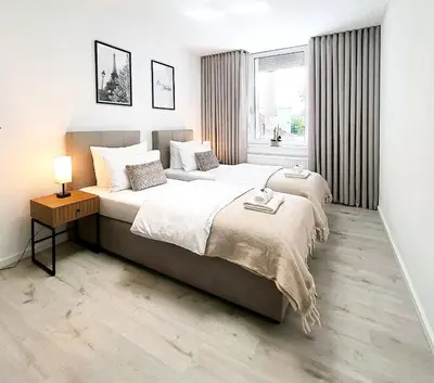Ein Bett oder Betten in einem Zimmer der Unterkunft LIVATION - Apartments Hamm-Mitte - 2 Zi - Nespresso - SmartTV - freeWiFi - ausgestattete Küche - 24h Check-In - bis 4 Pers pro Apartment