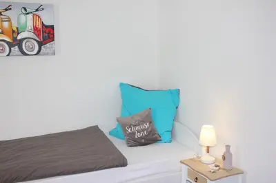 Ein Bett oder Betten in einem Zimmer der Unterkunft exklusive Ferienwohnung
