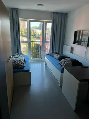 Ein Bett oder Betten in einem Zimmer der Unterkunft GreenStay Essen