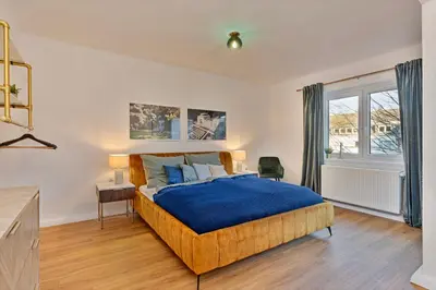 Ein Bett oder Betten in einem Zimmer der Unterkunft Villa trifft Zeche by Cordis Sky für bis zu 7 Personen 5 Minuten zur Messe Essen und zum Hauptbahnhof Essen