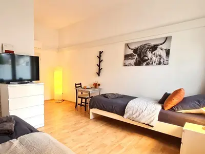 Ein Bett oder Betten in einem Zimmer der Unterkunft Modernes Apartment für 5 Personen