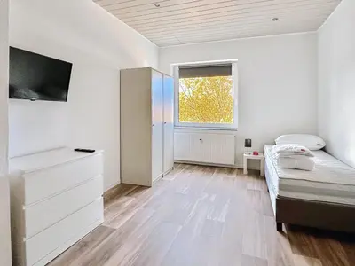 Ein Bett oder Betten in einem Zimmer der Unterkunft HomeAway24 - Apartments Oberhausen
