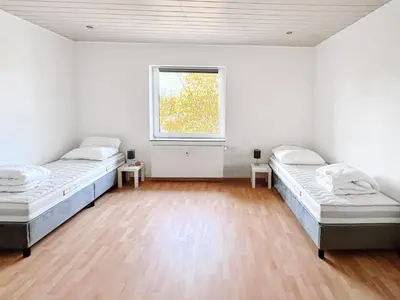 Ein Bett oder Betten in einem Zimmer der Unterkunft HomeAway24 - Apartments Oberhausen