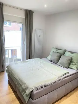 Ein Bett oder Betten in einem Zimmer der Unterkunft Moderne Wohnung in Unna Mitte