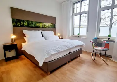 Ein Bett oder Betten in einem Zimmer der Unterkunft 135m²-Apartment I max. 8 Gäste I Zentral I Küche I Balkon I Parken I WLAN