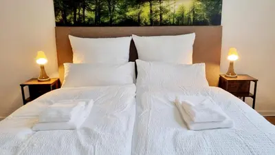 Ein Bett oder Betten in einem Zimmer der Unterkunft 135m²-Apartment I max. 8 Gäste I Zentral I Küche I Balkon I Parken I WLAN