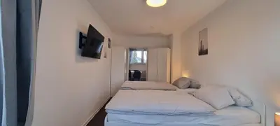 Ein Bett oder Betten in einem Zimmer der Unterkunft 3-Bett Wohnung im Boardinghaus Elisabeth