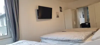 Ein Bett oder Betten in einem Zimmer der Unterkunft 3-Bett Wohnung im Boardinghaus Elisabeth