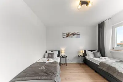 Ein Bett oder Betten in einem Zimmer der Unterkunft VINFUL: Premium-Apartment mit Balkon und Parkplatz