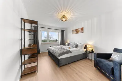 Ein Bett oder Betten in einem Zimmer der Unterkunft VINFUL: Premium-Apartment mit Balkon und Parkplatz