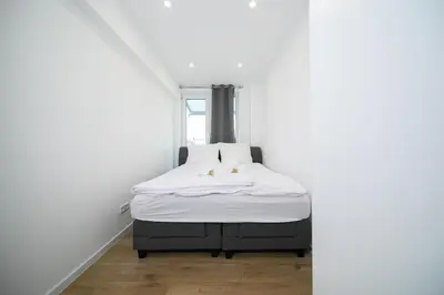 Ein Bett oder Betten in einem Zimmer der Unterkunft Apartment - 3 Bedroom - 6 Person