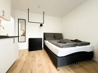 Ein Bett oder Betten in einem Zimmer der Unterkunft Vibehome Düsseldorf - Stadtmitte