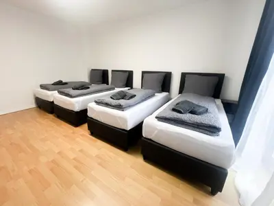 Ein Bett oder Betten in einem Zimmer der Unterkunft Vibehome Düsseldorf - Stadtmitte