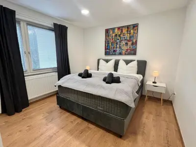 Ein Bett oder Betten in einem Zimmer der Unterkunft RUEHOME