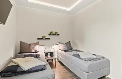 Ein Bett oder Betten in einem Zimmer der Unterkunft 24-7 Living - Modern Apartments in Waltrop with Top Connection