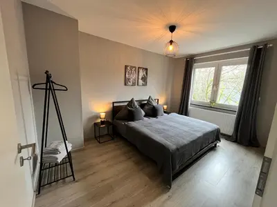 Ein Bett oder Betten in einem Zimmer der Unterkunft Apartment Central 10H 75qm Wi-Fi free Parking
