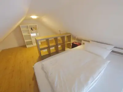 Ein Bett oder Betten in einem Zimmer der Unterkunft Gerritz+Gäste