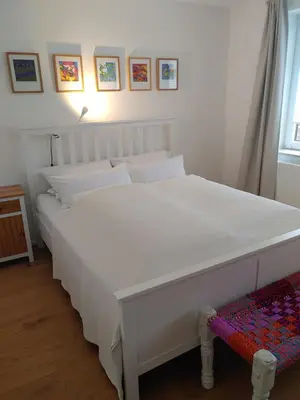 Ein Bett oder Betten in einem Zimmer der Unterkunft Gerritz+Gäste