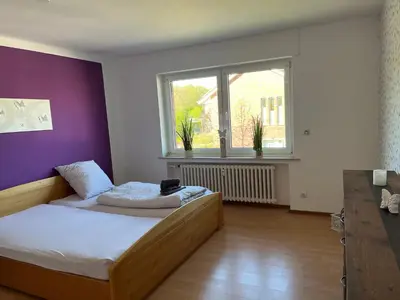 Ein Bett oder Betten in einem Zimmer der Unterkunft Red Dot Apartments