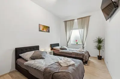 Ein Bett oder Betten in einem Zimmer der Unterkunft Zentrale Lage ... Ideal für Geschäftsleute, Monteure, Familien...3 Zimmer, Wlan, SmartTV