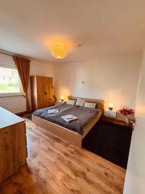 Ein Bett oder Betten in einem Zimmer der Unterkunft Moderne Ferienwohnung Iserlohn 2