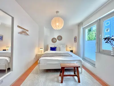 Ein Bett oder Betten in einem Zimmer der Unterkunft TIMELESS APARTMENT: FREE PARKING + BALCONY