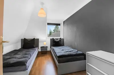 Ein Bett oder Betten in einem Zimmer der Unterkunft 24-7 Living - Unna Central City Apartments